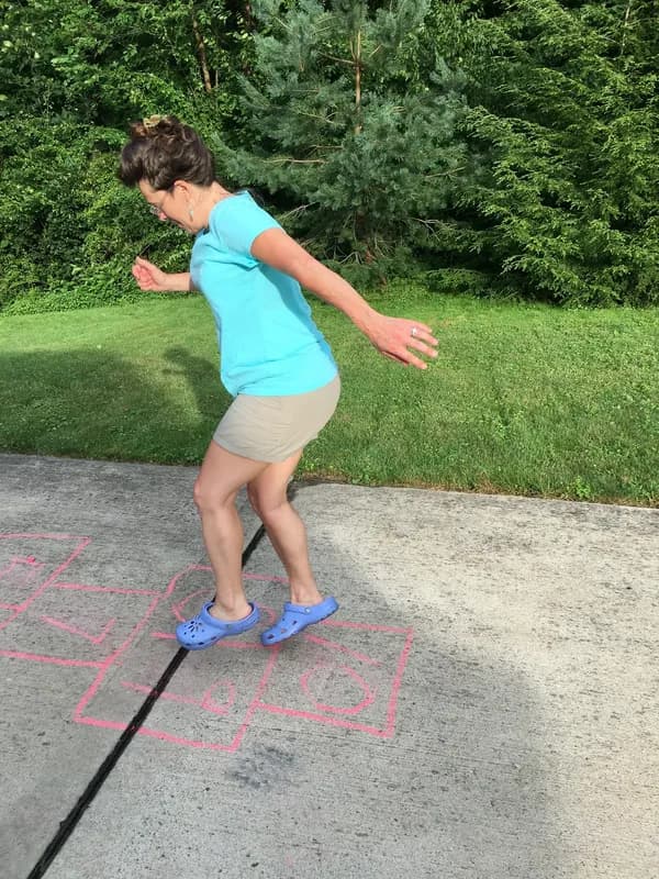 Jennifer playing hopscotch